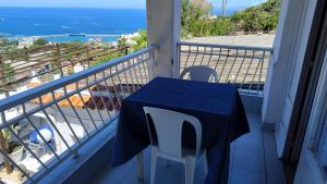 a table and chairs on a balcony with a view of the ocean at Casa Lucia in Casamicciola Terme