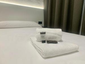 Postel nebo postele na pokoji v ubytování Hotel DL Urban