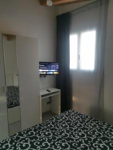 TV a/nebo společenská místnost v ubytování Oasi delle Querce Luxury Home