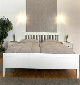Posteľ alebo postele v izbe v ubytovaní Diamond Apartman