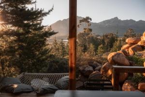 a view of a mountain from the porch of a house at Barn Owl Cabin at Vrolikheid Landgoed in Tulbagh