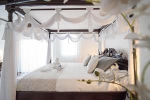 Postel nebo postele na pokoji v ubytování Hotel Avenida Tropical by Bossh! Hotels