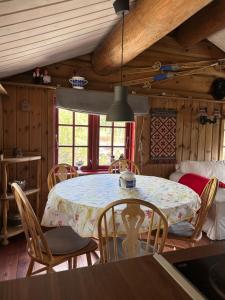 a dining room with a table and chairs at Holiday cabin, Kristianplass at Bjorli, Lesja in Bjorli