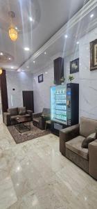 a large living room with couches and a television at العييري للشقق المخدومة الباحة 4 in Al Baha +5 photos