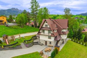 an aerial view of a house with a roof at Willa Tatra House in Zakopane