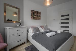 Posteľ alebo postele v izbe v ubytovaní Apartamenty City Center - Zdrojowe