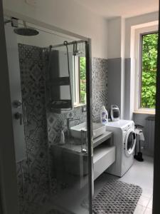 a bathroom with a shower and a sink at Casa Mimmo in Azzano San Paolo