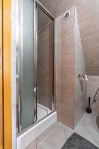 a shower with a glass door in a bathroom at Willa Tatra House in Zakopane +112 photos