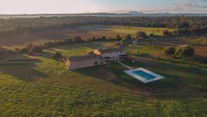an aerial view of a house in a field with a swimming pool at Son Seriol in Inca