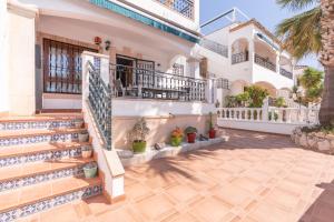 a house with a staircase in front of it at Casa Lisanofa in Orihuela