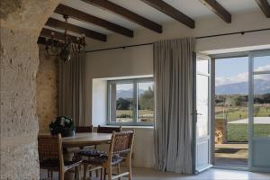 a dining room with a table and a window at Son Seriol in Inca