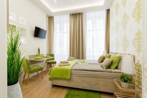 a bedroom with a bed and a table and a dining room at Budapest Holiday Colours in Budapest