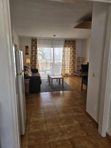 a living room with a couch and a table at The Colors House, 646 y 524 - Private Apartments in Costa Teguise +46 photos