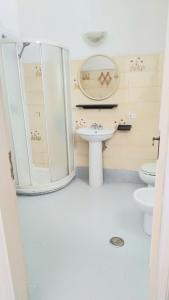 a bathroom with a sink and a toilet at Casa Lucia in Casamicciola Terme