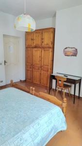 a bedroom with a bed and a table and a desk at Casa Lucia in Casamicciola Terme +30 photos