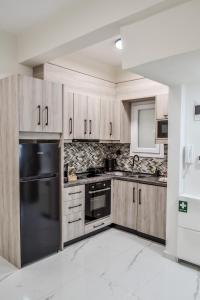 Η κουζίνα ή μικρή κουζίνα στο Eve's Central Comfort Apartment #1