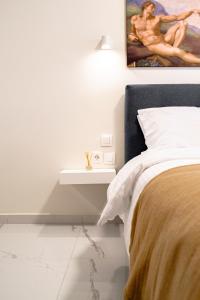 Ένα ή περισσότερα κρεβάτια σε δωμάτιο στο Eve's Central Comfort Apartment #1