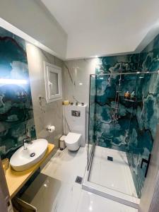 Ένα μπάνιο στο Eve's Central Comfort Apartment #1