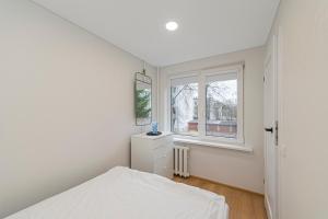 Postel nebo postele na pokoji v ubytování Apartment Lampėdis by Polo Apartments