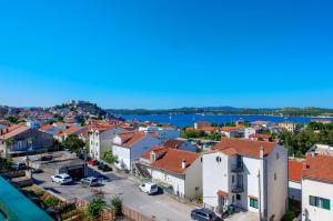 an aerial view of a city with buildings and the water at ABI Attic Apartment in Šibenik