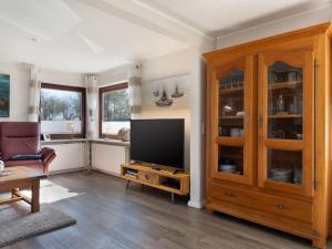 TV a/nebo společenská místnost v ubytování Ferienhaus Am Ankerplatz