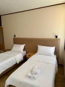 Postel nebo postele na pokoji v ubytování Hotel Epidami