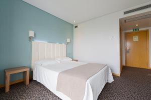 Cama o camas de una habitación en Hotel Azinheira by RIDAN Hotels