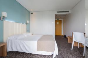 Cama o camas de una habitación en Hotel Azinheira by RIDAN Hotels