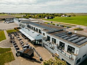an aerial view of a building with a train station at Studio's De Vlijt Texel in De Cocksdorp