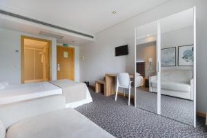 Cama o camas de una habitación en Hotel Azinheira by RIDAN Hotels