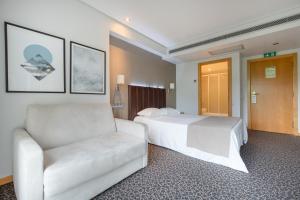 Cama o camas de una habitación en Hotel Azinheira by RIDAN Hotels