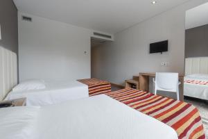 Cama o camas de una habitación en Hotel Azinheira by RIDAN Hotels
