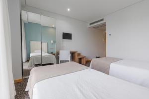 Cama o camas de una habitación en Hotel Azinheira by RIDAN Hotels