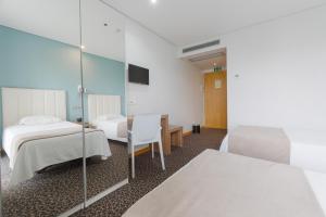 Cama o camas de una habitación en Hotel Azinheira by RIDAN Hotels