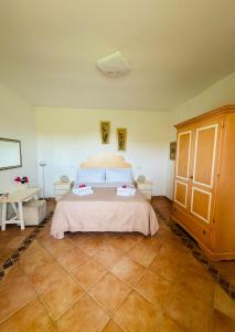 a bedroom with a bed in a room at Le Petite Suite in Porto Pozzo +30 photos