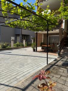 an open patio with a table and awning at Miles Apartment in Ohrid +1 photo