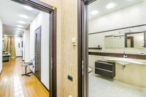a bathroom with a sink and a mirror at Apartment City Centre in Baku +47 photos