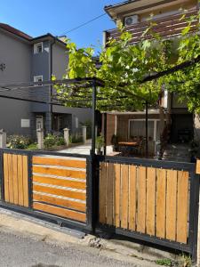 a wooden gate in front of a house at Miles Apartment in Ohrid