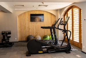a room with a gym with a treadmill and weights at Royal Savoy Sharm El Sheikh in Sharm El Sheikh