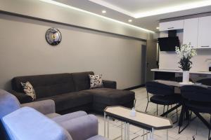 a living room with a couch and a table at No25 Suites Nisantasi in Istanbul +27 photos