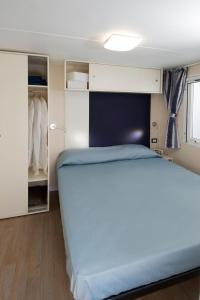 Säng eller sängar i ett rum på Camping San Michele