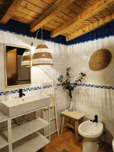 a bathroom with a sink and a toilet at Montes da Salvada in Melides +19 photos