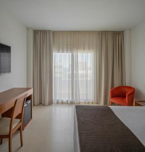 Postel nebo postele na pokoji v ubytování Hotel Santamarta