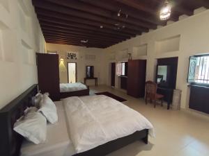 Ein Bett oder Betten in einem Zimmer der Unterkunft Hyba Heritage Guest House