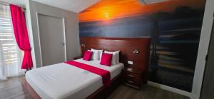 Voodi või voodid majutusasutuse Tulip Inn Sainte Clotilde, La Réunion toas
