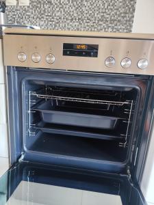 Kuchyň nebo kuchyňský kout v ubytování Afrodites sea view house