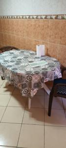 a table with a quilt on it in a room at Grand Appt près de la mer in Hajreien +7 photos