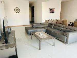 a living room with a couch and a table at Douceur de Vie in Praia
