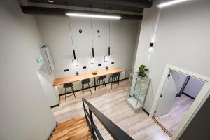 an overhead view of a room with a table and chairs at BOLD Stay - New Self Check-In Hostel in City Center in Tallinn