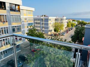 an apartment balcony with a view of a parking lot at Douceur de Vie in Praia